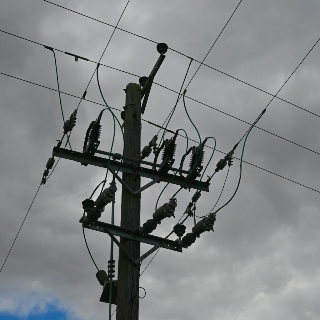 a telephone pole with many wires and wires attached to it